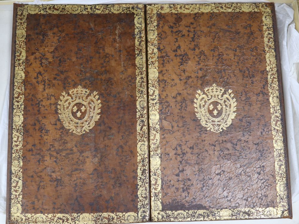 A French gilt tooled and brown leather double folding desk blotter, with retailers box for Armorial Palais de Congres, Paris